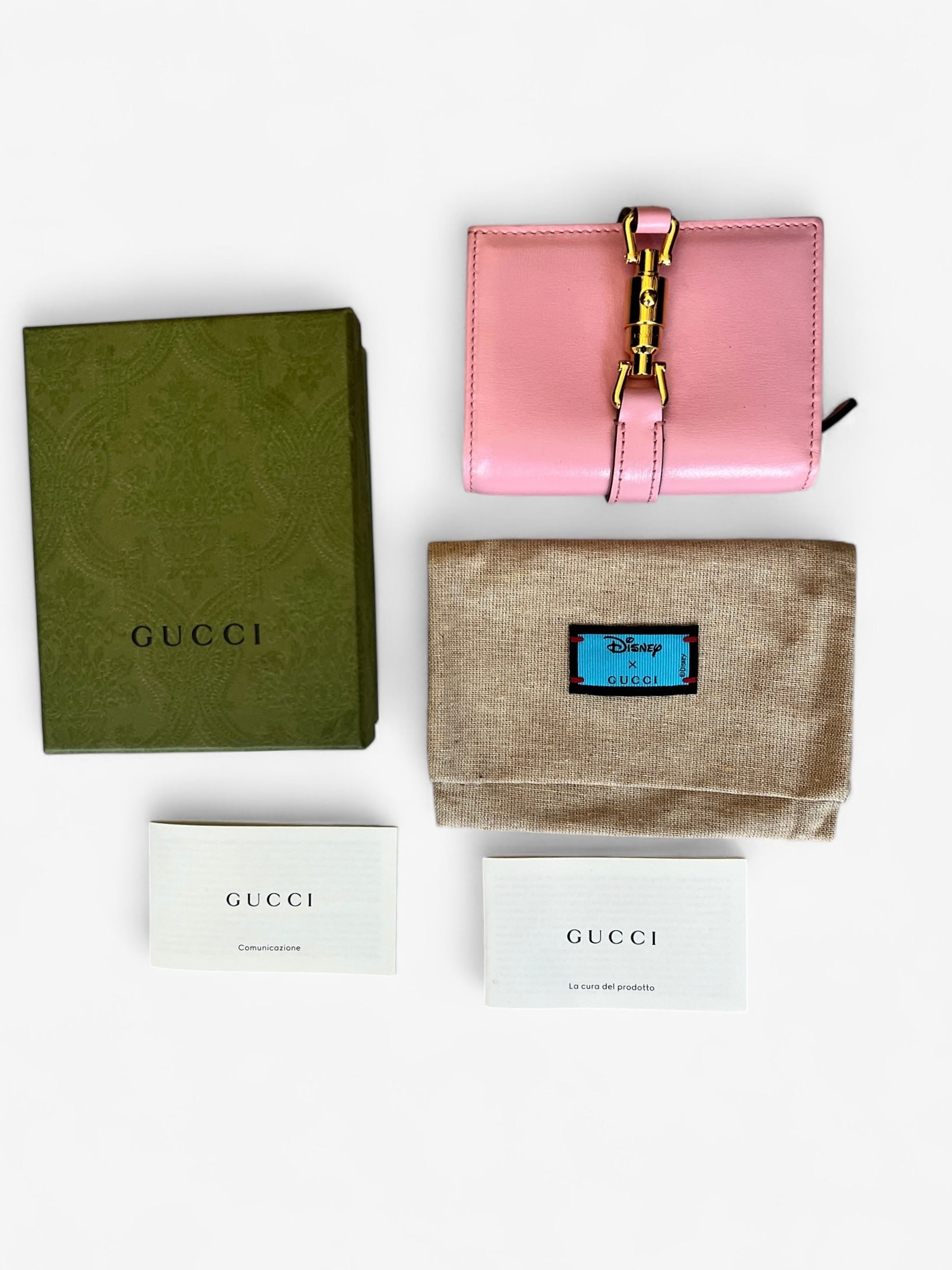 portefeuille Gucci Jackie 1961 de couleur rose.
